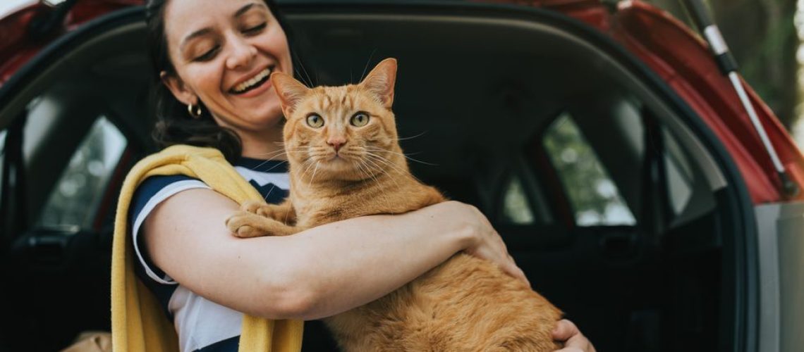 traveling-with-a-cat-woman-holding-cat-in-car-1644513685